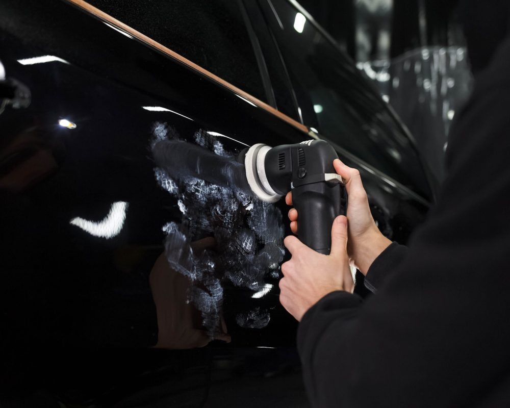 auto-polishing-process-detailing-worker-polishes-car-body (1)